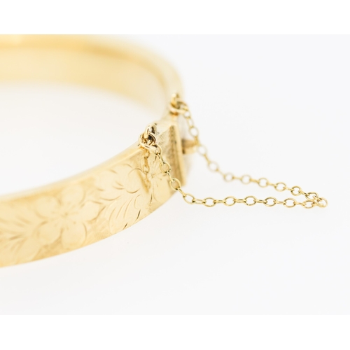 361 - 9 Carat Yellow Gold Bangle Bracelet Incised Floral Detailing Inner Width 6.5cm