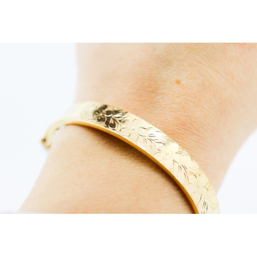 361 - 9 Carat Yellow Gold Bangle Bracelet Incised Floral Detailing Inner Width 6.5cm