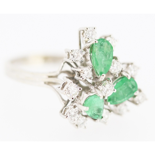 375 - Finely Detailed Pear Cut Emerald Three Stone and Diamond Cluster Ring Set in 14 Carat White Gold Rin... 