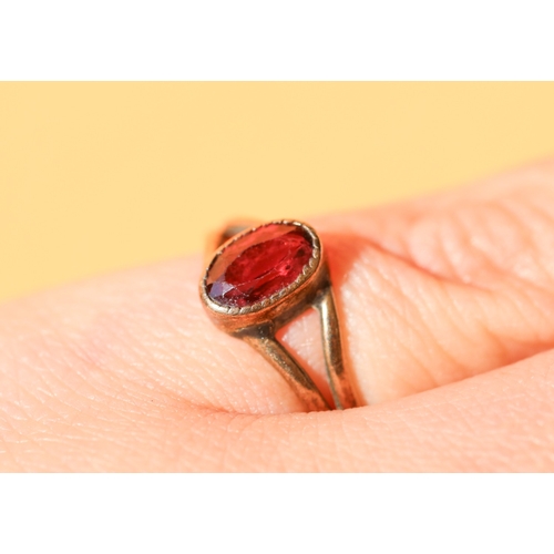 41 - Red Garnet Bezel Set Single Stone Ring Mounted in 9 Carat Yellow Gold Ring Size L and a Half