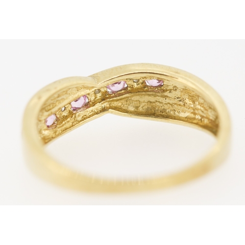 423 - Pink Sapphire and Diamond Set Crossover Motif Ring Mounted in 9 Carat Yellow Gold Ring Size P