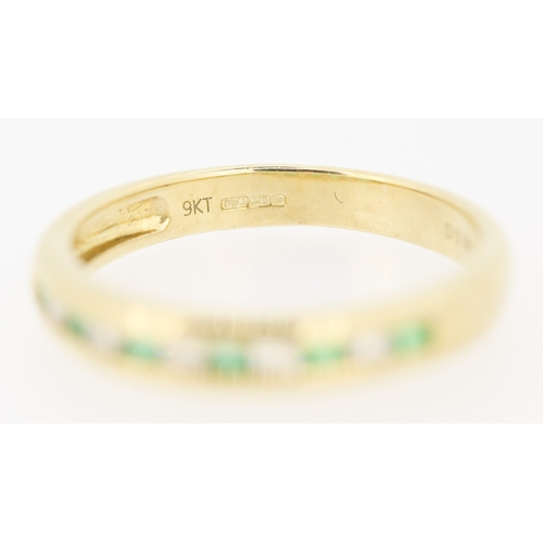 432 - Emerald and Diamond Channel Set Half Eternity Ring Mounted in 9 Carat Yellow Gold Ring Size N