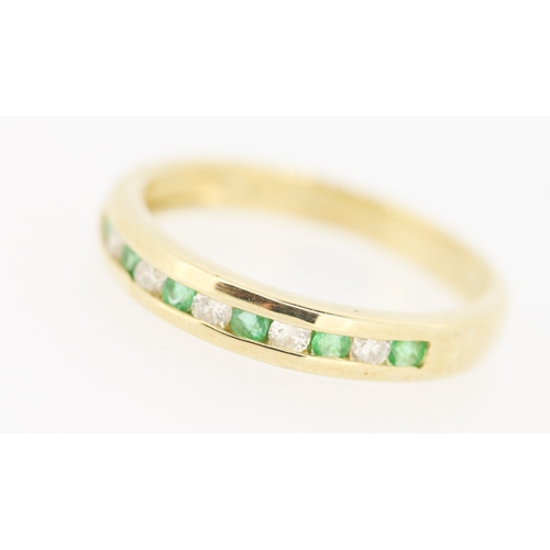 432 - Emerald and Diamond Channel Set Half Eternity Ring Mounted in 9 Carat Yellow Gold Ring Size N