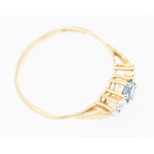 480 - Blue Topaz and Diamond Set Ring Mounted in 9 Carat Yellow Gold Ring Size U