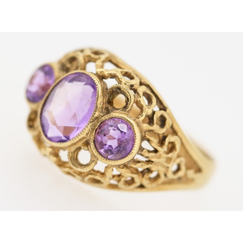 503 - Three Stone Bezel Set Amethyst Ring Mounted on 9 Carat Yellow Gold Openwork Scroll Setting Ring Size... 