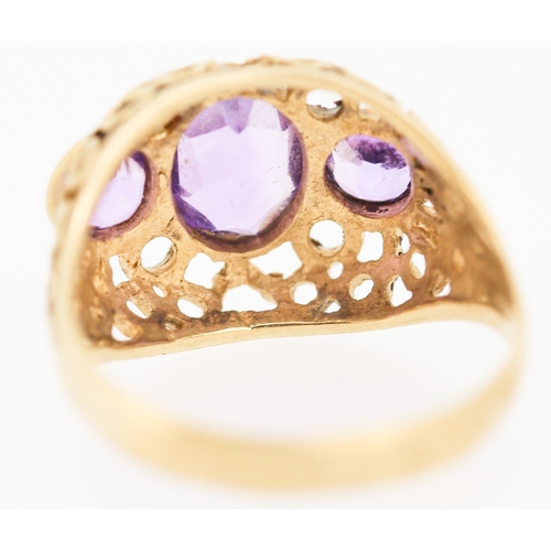 503 - Three Stone Bezel Set Amethyst Ring Mounted on 9 Carat Yellow Gold Openwork Scroll Setting Ring Size... 