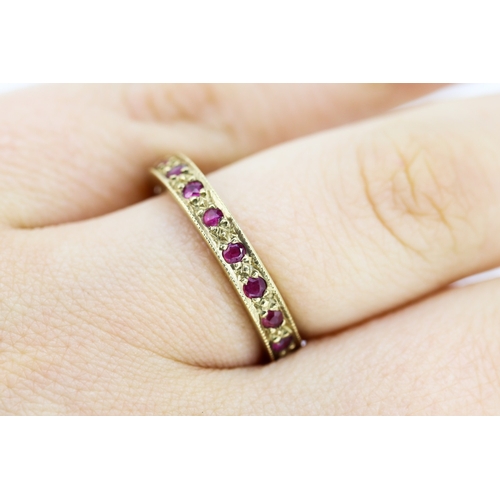 544 - Ruby Set Eternity Ring Mounted in 9 Carat Yellow Gold Ring Size Q