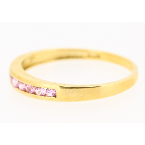 56 - Pink Tourmaline Nine Stone Channel Set Ring Mounted in 9 Carat Yellow Gold Ring Size W