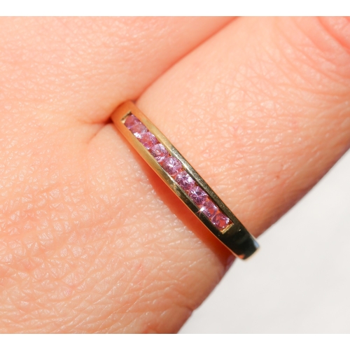 56 - Pink Tourmaline Nine Stone Channel Set Ring Mounted in 9 Carat Yellow Gold Ring Size W