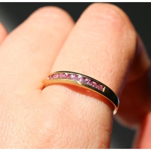 56 - Pink Tourmaline Nine Stone Channel Set Ring Mounted in 9 Carat Yellow Gold Ring Size W