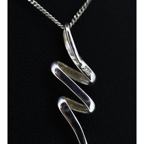 588 - 9 Carat White Gold Swirl Motif Pendant 2cm Set on 9 Carat White Gold Chain 40cm Long