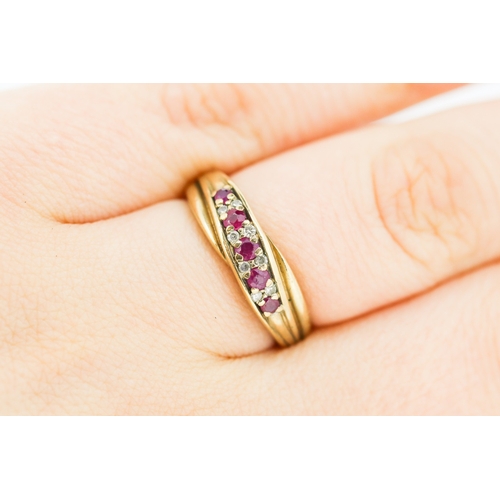 593 - Ruby and Diamond Set Crossover Form Ring Mounted in 9 Carat Yellow Gold Ring Size L and a Half