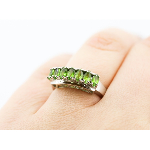 6 - Green Tourmaline Marquise Cut Seven Stone Ring Mounted in 9 Carat White Gold Ring Size N