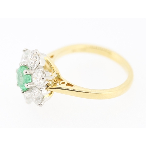 60 - Emerald and Diamond Set Daisy Form Cluster Ring Mounted in 18 Carat Yellow Gold Total Emerald Carat ... 