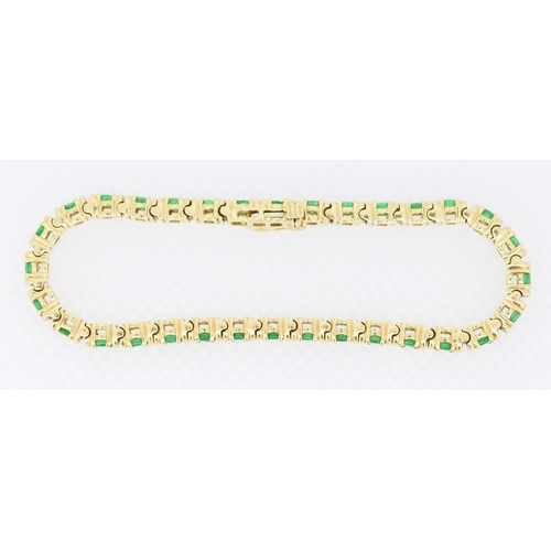 62 - Emerald Thirty Two Stone Set Tennis Bracelet Mounted in 18 Carat Yellow Gold 17.5cm Long