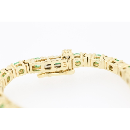 62 - Emerald Thirty Two Stone Set Tennis Bracelet Mounted in 18 Carat Yellow Gold 17.5cm Long