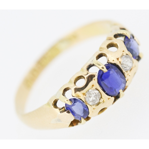 627 - Three Stone Sapphire and Diamond Set Ring Mounted in 18 Carat Yellow Gold Ring Size J