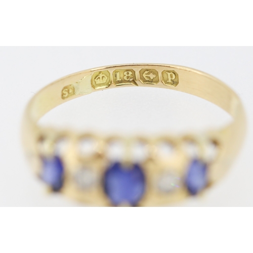 627 - Three Stone Sapphire and Diamond Set Ring Mounted in 18 Carat Yellow Gold Ring Size J