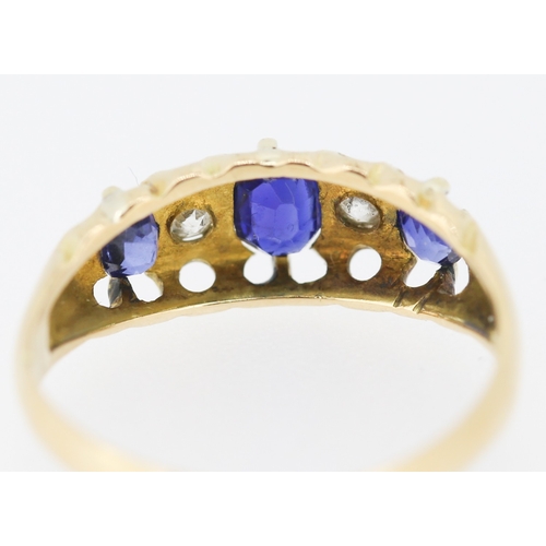 627 - Three Stone Sapphire and Diamond Set Ring Mounted in 18 Carat Yellow Gold Ring Size J