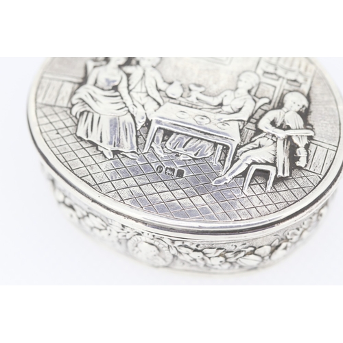 636 - Attractively Detailed Silver Snuff Box Oval Form Festive Scene Hinge Cover 6.5cm Wide