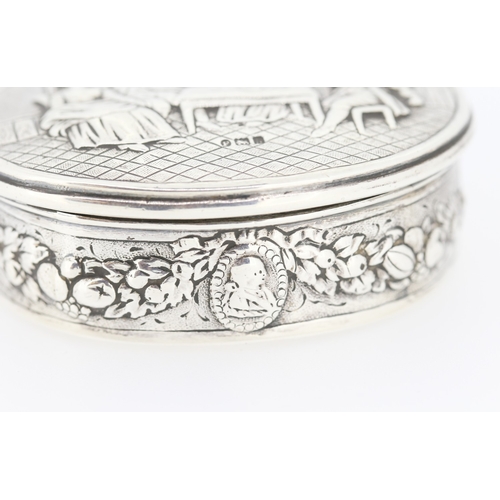 636 - Attractively Detailed Silver Snuff Box Oval Form Festive Scene Hinge Cover 6.5cm Wide