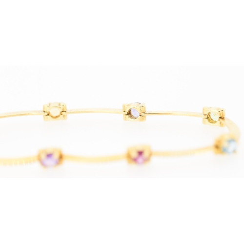 64 - Tutti Frutti Eight Stone Set Bracelet Tourmaline Amethyst Citrine and Blue Topaz Mounted in 18 Carat... 