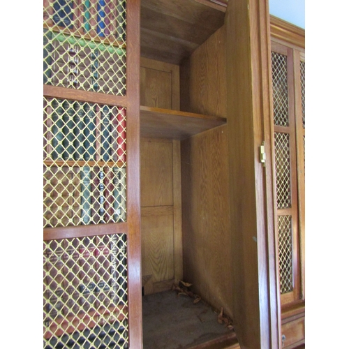 700 - Bookcase of Imposing Size with Upper Brass Grill Doors above Drawers to Base Breakfront Form Attract... 