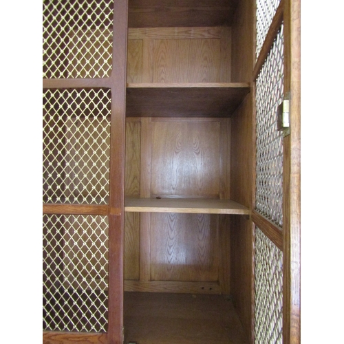 700 - Bookcase of Imposing Size with Upper Brass Grill Doors above Drawers to Base Breakfront Form Attract... 