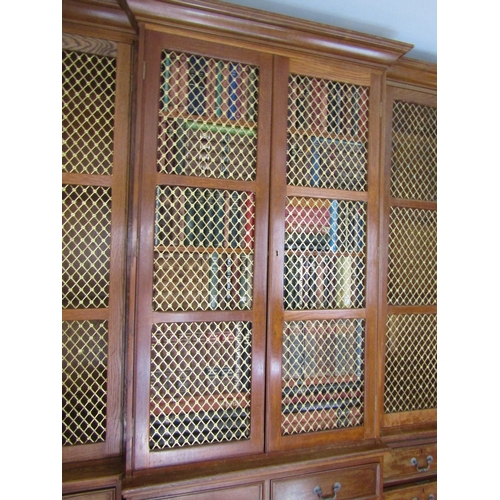 700 - Bookcase of Imposing Size with Upper Brass Grill Doors above Drawers to Base Breakfront Form Attract... 