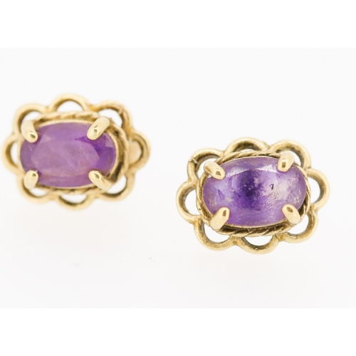 71 - Pair of Amethyst Set Earrings Mounted in 9 Carat Yellow Gold 7mm High