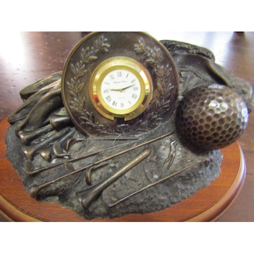 712 - Royal Tara Bronze Golfing Motif Clock Mahogany Oval Base Approximately 7 Inches Wide