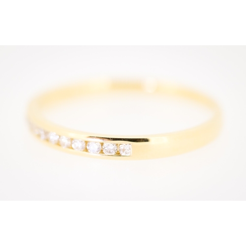 77 - Diamond Ten Stone Channel Set Band Ring Mounted in 18 Carat Yellow Gold Ring Size R