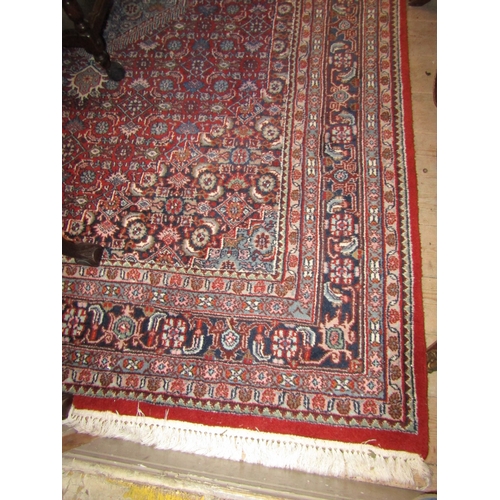 777 - Persian Pure Wool Rug Burgundy and Navy Ground Approximately 9ft 8 Inches Long x 6ft 6 Inches Wide