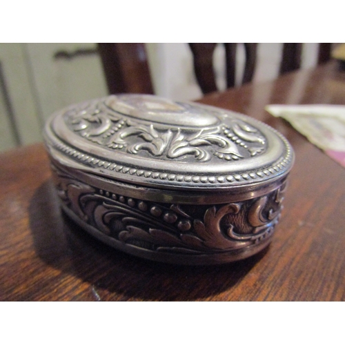 797 - Silver Desk Box Oval Form Hinged Cover Embossed Decoration Approximately 7cm Diameter Continental