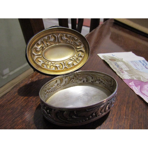 797 - Silver Desk Box Oval Form Hinged Cover Embossed Decoration Approximately 7cm Diameter Continental