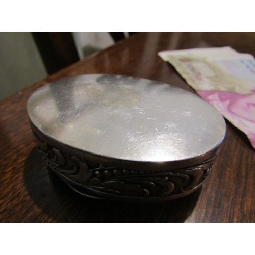 797 - Silver Desk Box Oval Form Hinged Cover Embossed Decoration Approximately 7cm Diameter Continental