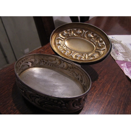 797 - Silver Desk Box Oval Form Hinged Cover Embossed Decoration Approximately 7cm Diameter Continental