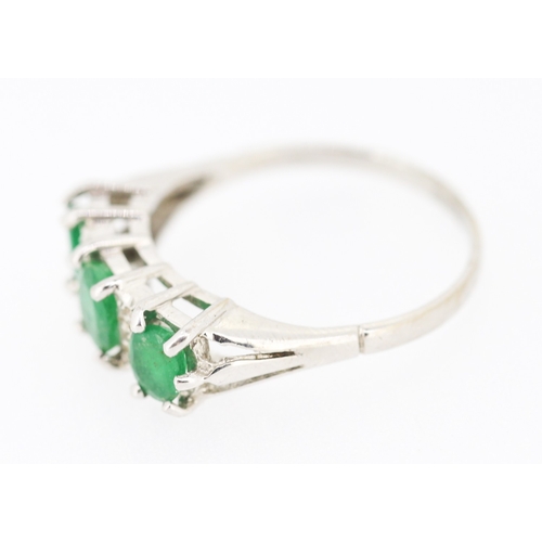 80 - Emerald Three Stone Ring with Diamond Insets Mounted in 18 Carat White Gold Ring Size P and a Half