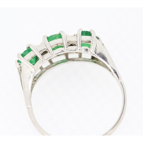 80 - Emerald Three Stone Ring with Diamond Insets Mounted in 18 Carat White Gold Ring Size P and a Half