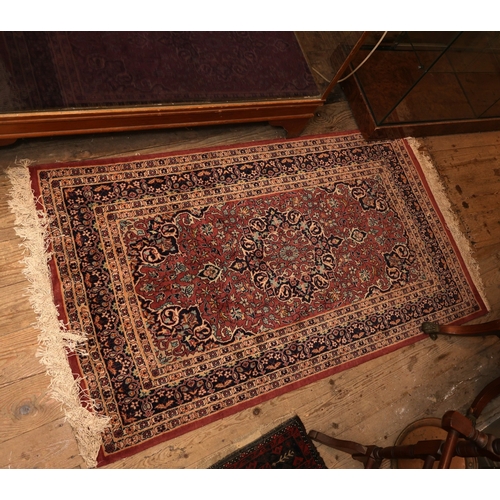 853 - Persian Pure Wool Rug Burgundy and Navy Ground Patterned Borders Approximately 4ft 6 Inches Long x 3... 