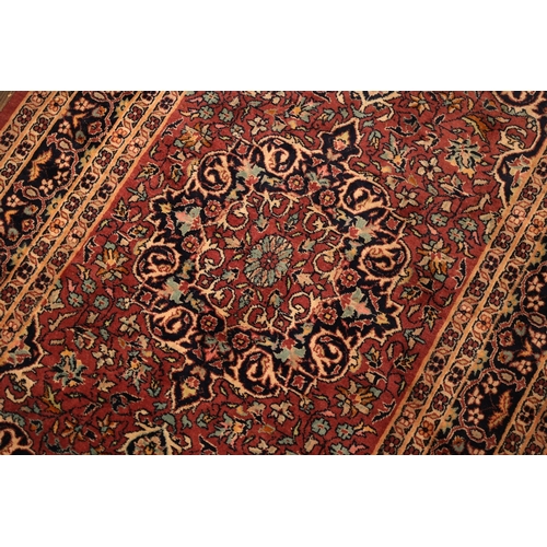 853 - Persian Pure Wool Rug Burgundy and Navy Ground Patterned Borders Approximately 4ft 6 Inches Long x 3... 