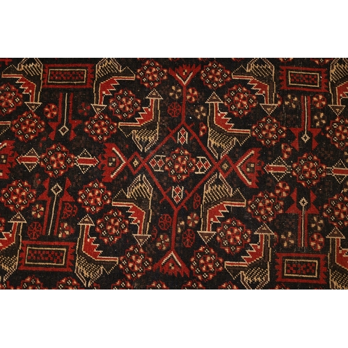 854 - Persian Pure Wool Rug Burgundy and Navy Ground Patterned Borders Approximately 5ft Long x 3ft Wide