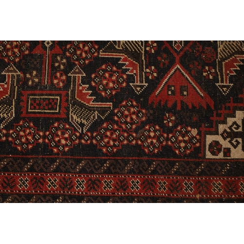 854 - Persian Pure Wool Rug Burgundy and Navy Ground Patterned Borders Approximately 5ft Long x 3ft Wide