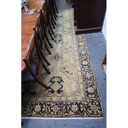 913 - Antique Persian Rug Pale Ochre Ground with Dark Navy Blue Border Approximately 13ft Long x 10ft Wide