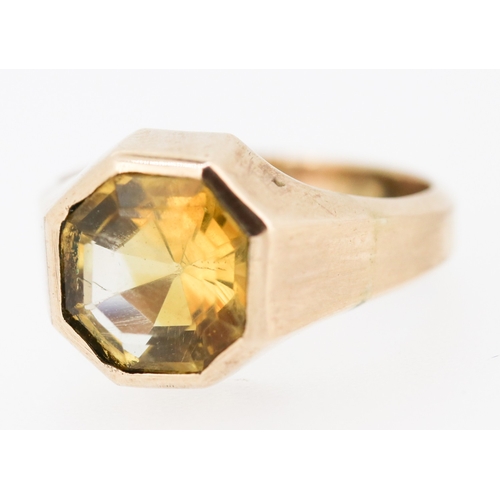 94 - Bezel Set Citrine Single Stone Octagon Form Ring Mounted in 9 Carat Rose Gold Ring Size R