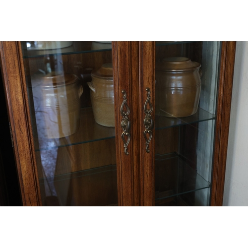 943 - Walnut Two Door Display Cabinet Cupboard Base Below Shaped Pediment Interior Lighting Three Glass Sh... 