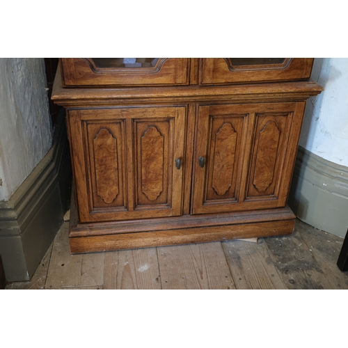 943 - Walnut Two Door Display Cabinet Cupboard Base Below Shaped Pediment Interior Lighting Three Glass Sh... 