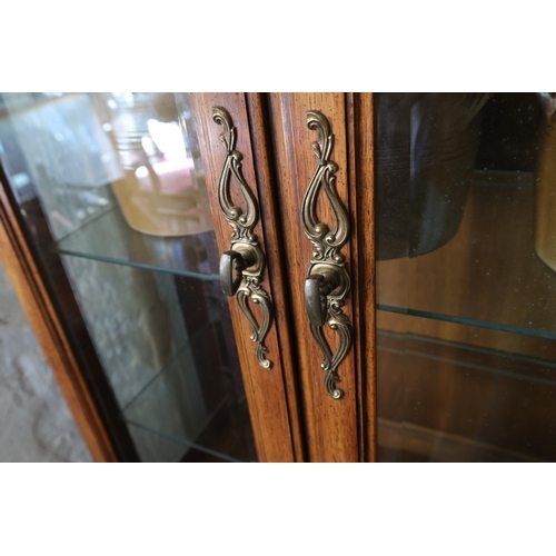 943 - Walnut Two Door Display Cabinet Cupboard Base Below Shaped Pediment Interior Lighting Three Glass Sh... 