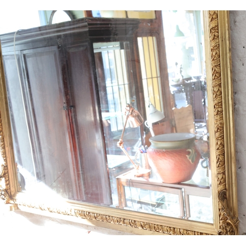 980 - Gilded Over Mantle Mirror Arched Top Side Carved Decoration Approximately 50 Inches Wide x 54 Inches... 