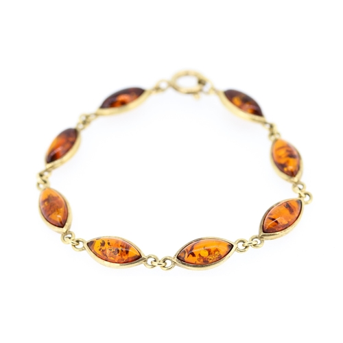 61 - Amber Eight Stone Set Bracelet Mounted in 9 Carat Yellow Gold 19.5cm Long